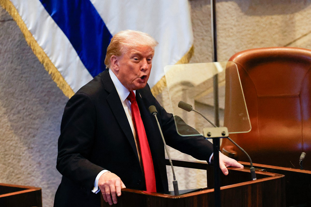 US President Donald Trump addresses the Israeli parliament, the Knesset, in Jerusalem on October 13, 2025. (Photo by Jalaa MAREY / POOL / AFP)