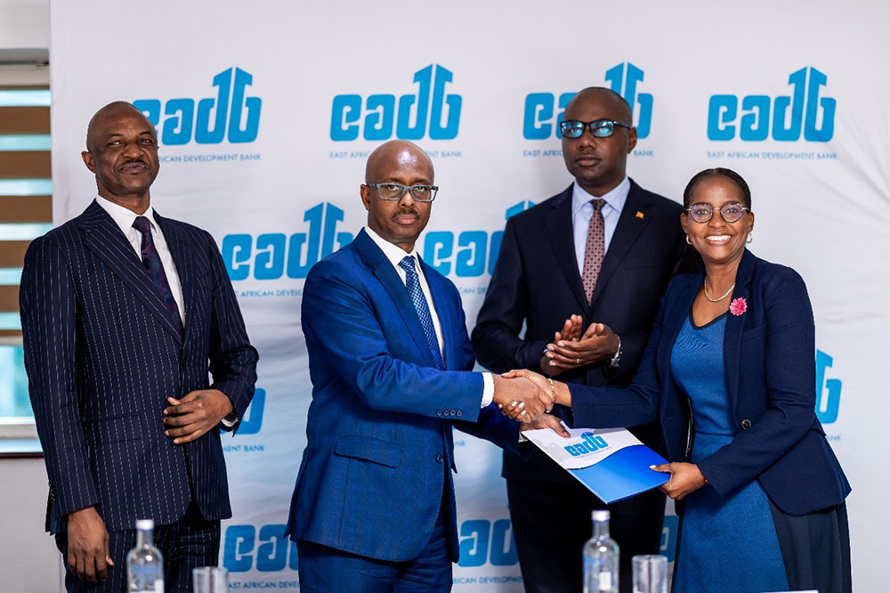Hon. Yusuf Murangwa, Rwanda’s Minister of Finance and Economic Planning and Chairman of the EADB Governing Council, hands over the contract to Anne Juuko, Director General of EADB, in the presence of Hon. Henry Musasizi, Uganda’s Minister of Finance, Planning and Economic Development and Member of the EADB Governing Council, and Dr. Ramathan Ggoobi, Chairperson of the EADB Board of Directors.