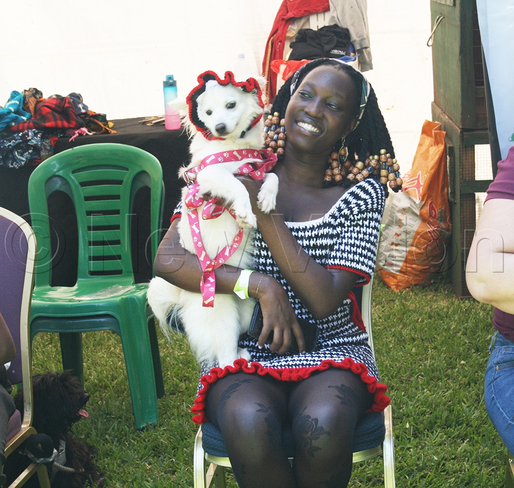 A young woman with her dog. (Credit: Maureen Nakatudde)