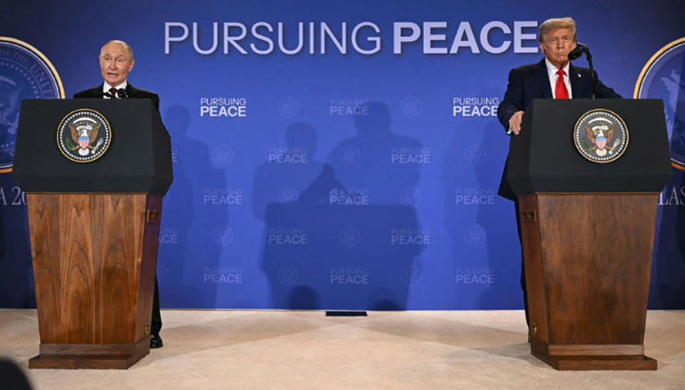 US President Donald Trump and Russian President Vladimir Putin speak after participating in their summit. (AFP Photo)