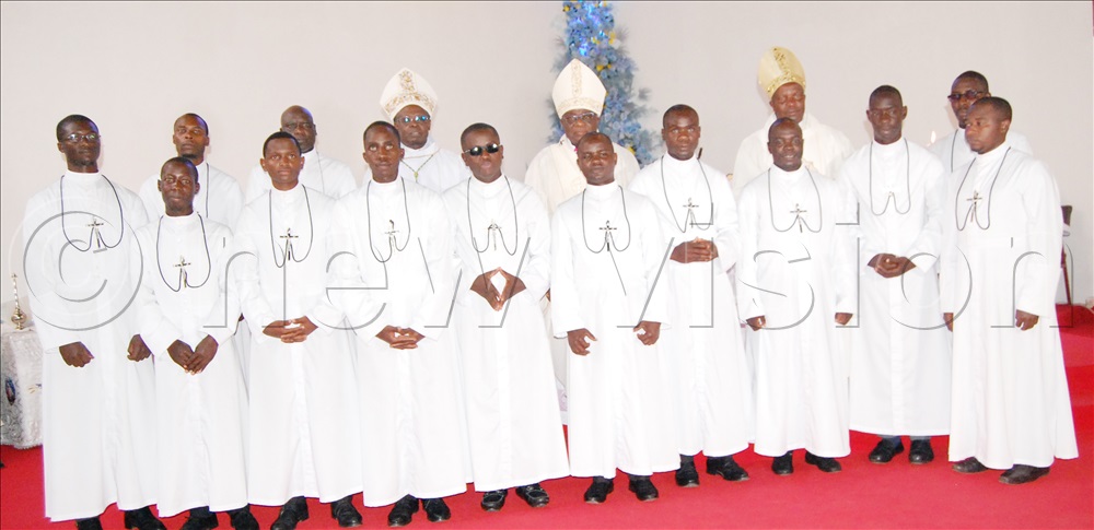 The 13 Brothers f Christian Instruction who took their first vows sharing a photo moment with the Catholic Prelates. 