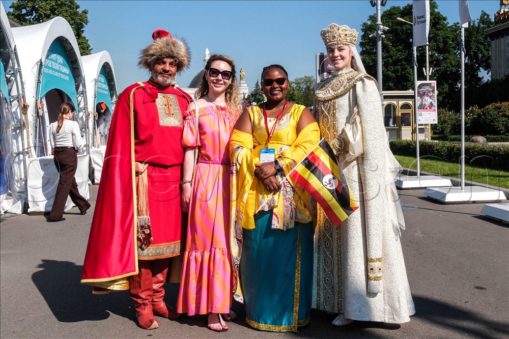 Betty Mbabazi (center) tour operator poses for a picture with Russian exhibitors during the Let's travel International Expo in Moscow, on June 10, 2026. 