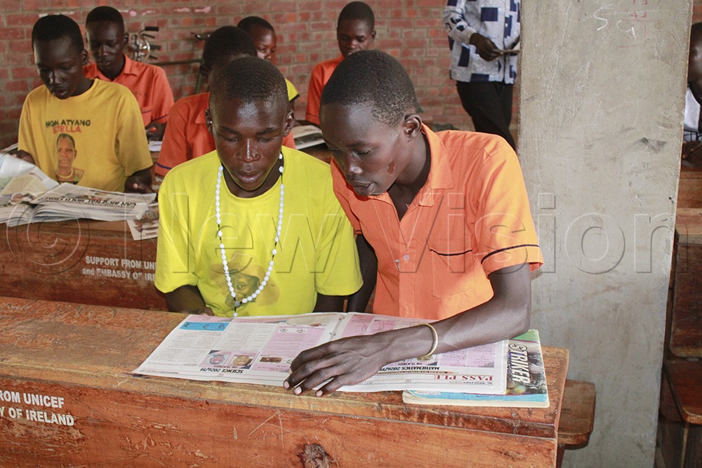 Primary Six pupils look forward to reading PASS PLE every week. (Credit: Ritah Mukasa)