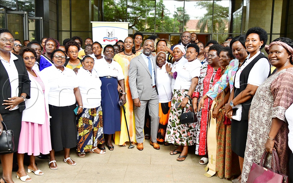 The Deputy Speaker of Parliament Rt. Hon. Thomas Tayebwa (1st row 6th left) in a group photo with some of the UWESO AGM delegates led by the Chairperson Olive Birungi Lumonya (3rd right) and the Chief Executive Officer Jolly K. Kaguhangire. (2nd right). 