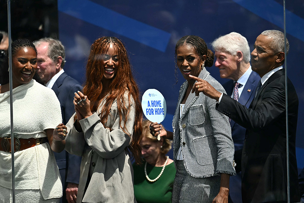 Former US president Barack Obama, his wife Michelle Obama and their daughters Malia and Sasha attend the opening of the Barack Obama Presidential Center in Chicago, Illinois, on June 18, 2026. (Photo by Kent NISHIMURA / AFP)