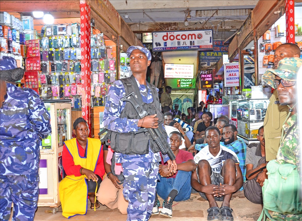 Suspects apprehended during a joint security operation as several arcades were raided in search of laptops and other items stolen from the Bank of Uganda (BOU) building on Plot 45, Kampala Road. This was on Monday, May 4, 2026. 