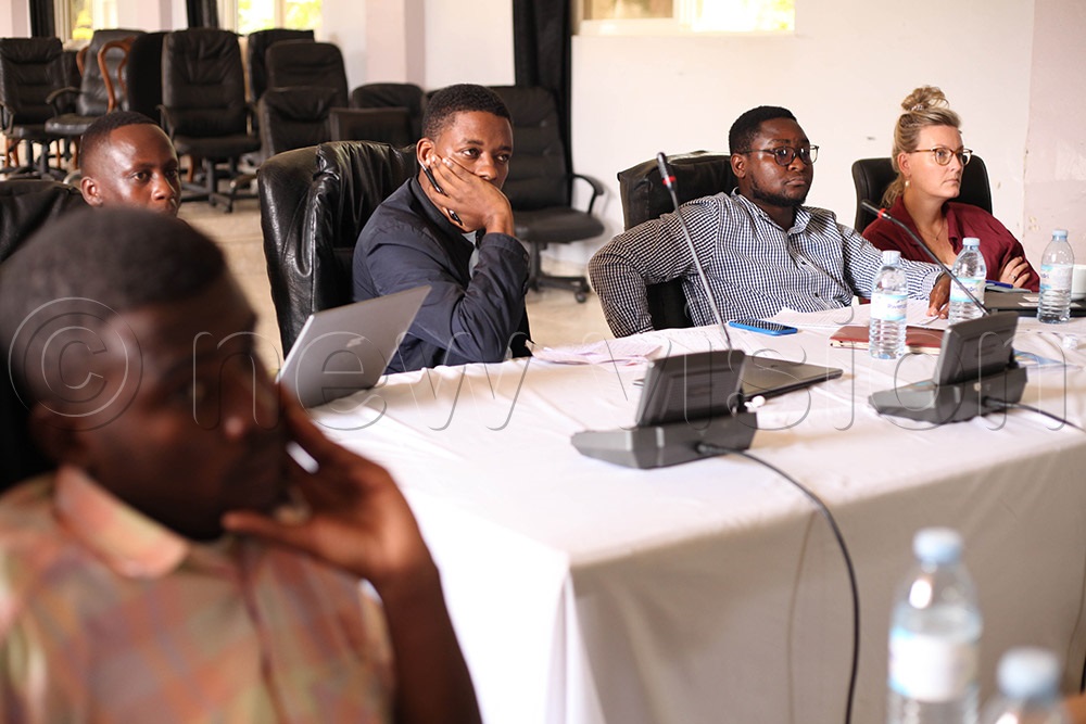 Judges listening while innovators present their innovation ideas during the final day of the bootcamp. (Photo by John Musenze)