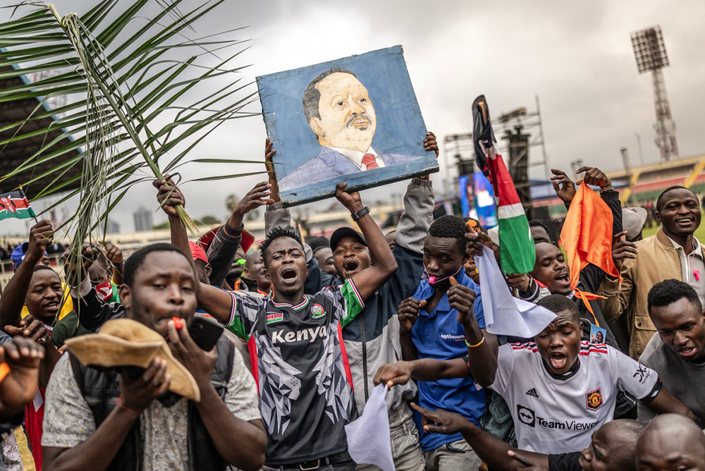 Mourners and supporters of Kenya’s opposition leader and former Prime Minister Raila Odinga chant slogans and hold a painting bearing his portrait as they gather ahead of his State Funeral at Nyayo Stadium in Nairobi on October 17, 2025. Kenyan opposition leader Raila Odinga has died at the age of 80 during a health visit to India, local police said on October 15, 2025. 
