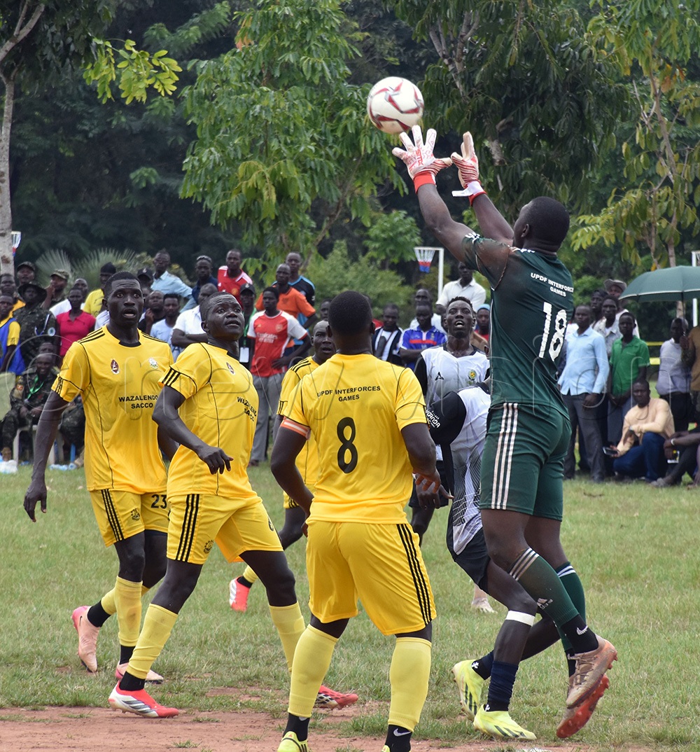 UWA's goalkeeper, Ronald Mutebi (No. 18), makes a crucial aerial save from a tough challenge by the UPDF attackers in the penalty area during the opening games of the 18th edition of the 2026 Inter-Forces Games at St. Joseph's College Layibi on August 24 in Gulu City. (Photo by Dennis Ojwee)