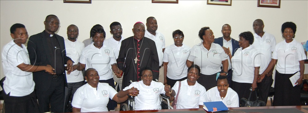 The archbishop of Kampala, Paul Ssemogerere (wearing a black cassock) shares a photo-moment with members of the Justice and Peace Department of the archdiocese during the launching of the Justice and Peace month at the archdiocesan headquarters at Lubaga Cathedral on Tuesday, August 25, 2026.