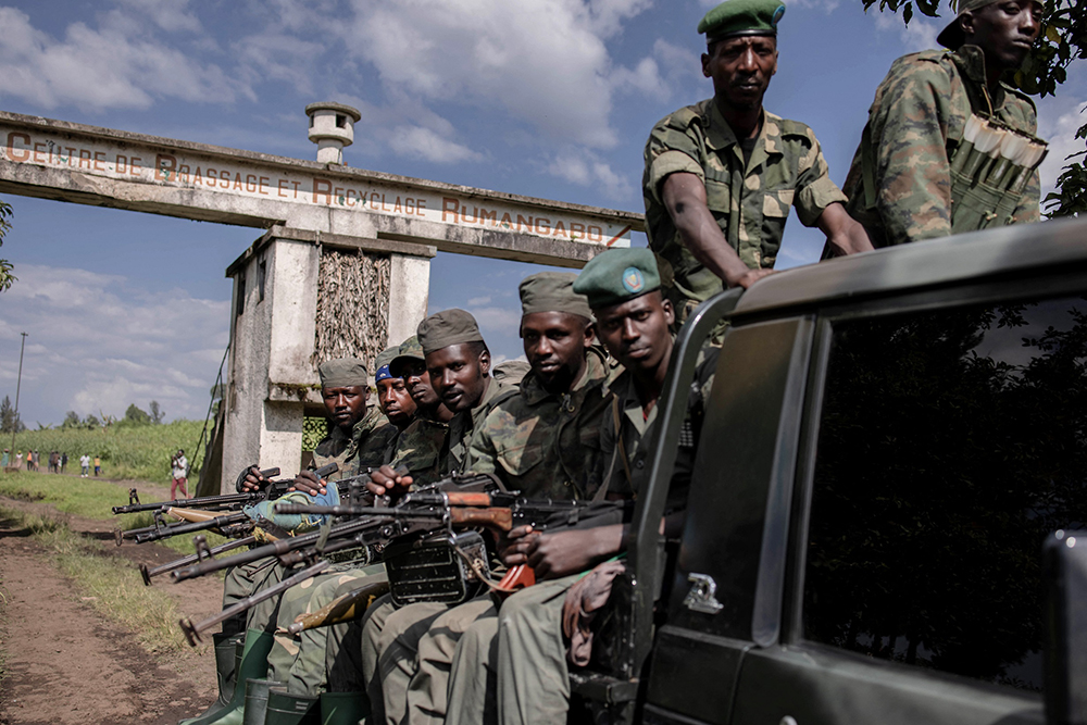 M23 soldiers leave leave Rumangabo camp after the meeting between EACRF officials and M23 rebels during the handover ceremony at Rumangabo camp in eastern Democratic Republic of Congo on January 6, 2023. (Credit: AFP)