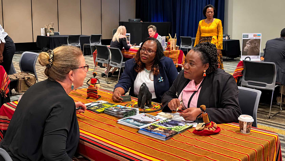 From left: Jane Achom, Finance Attaché in Australia, and Tiisa Suzan Mugwanya, Head of Tourism at Uganda’s Mission in Australia, speak with an Australian businesswoman, while Uganda’s High Commissioner to Australia, Dorothy Samali Hyuha, stands in the background. (Courtesy photo)