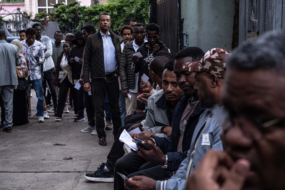 Voters queue to cast their votes outside a polling station at Shalla Park in Addis Ababa, on June 1, 2026, during the 2026 Ethiopian parliamentary elections. Ethiopians began voting on June 1, 2026 in parliamentary elections, with the party of outgoing Prime Minister Abiy Ahmed, who is running for another term, expected to win. (Credit: AFP)