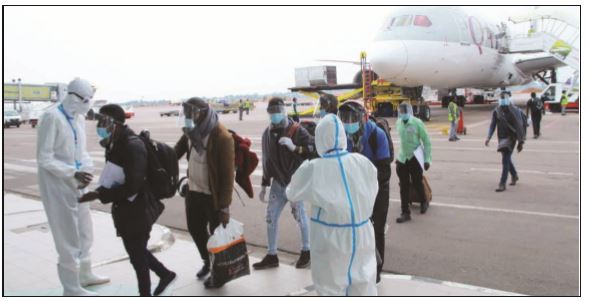 Ugandans being disinfected at Entebbe upon return aboard Qatar Airways special ﬂ ight