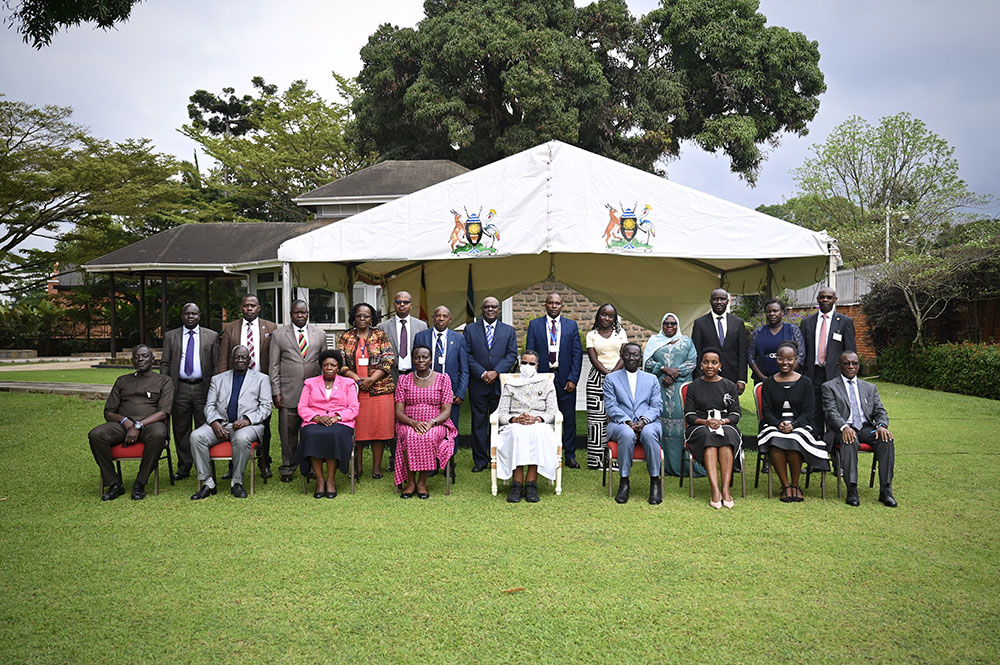 First Lady and Minister of Education and Sports, Hon. Janet K. Museveni, in a group photograph with Dr. Henry Wamani, his family, and officials from the Ministry of Education and Sports, Uganda Land Commission, National Council for Higher Education, and Bunyoro regional leaders after receiving land titles for the 97-acre Bunyoro University site at State House Nakasero. (PPU Photo)