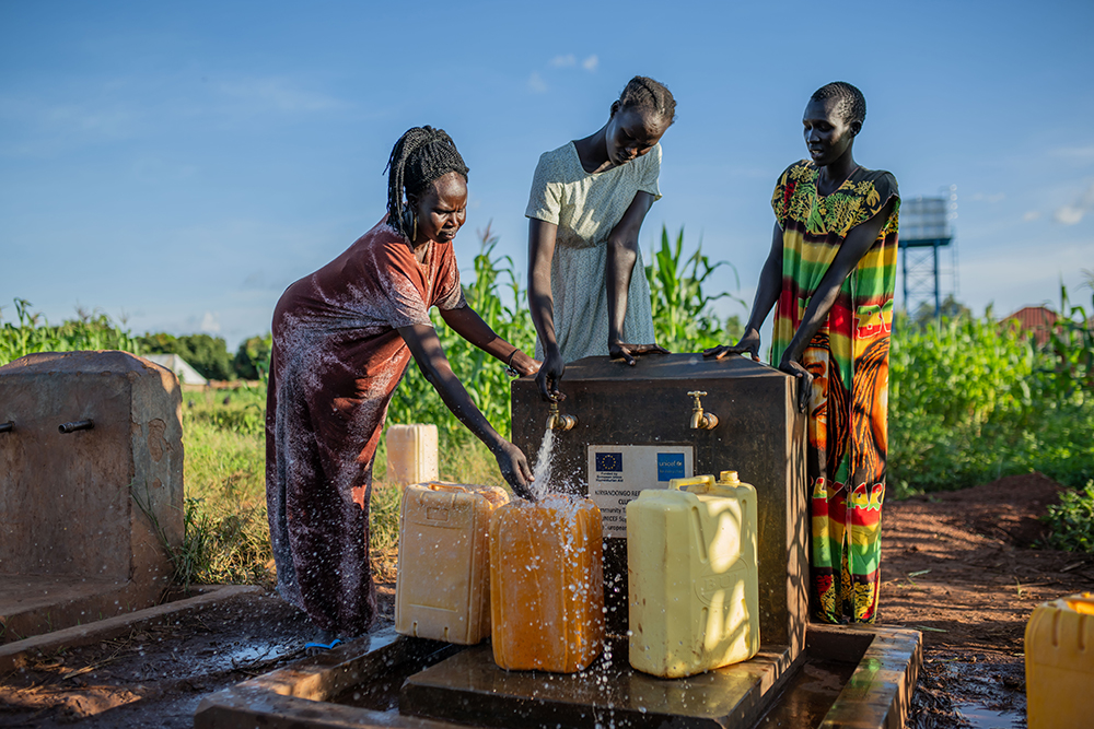 Residents of Cluster G fetching water from one of the community taps constructed by UNICEF with funding from the European Union in the area in Kiryandong Refugee settlement on October 14, 2025. (Courtesy)