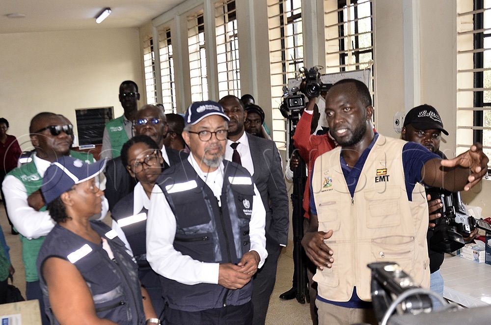 The WHO representative and Head of mission, Dr. Kasonde Mwinga, (left) looks on as the staff of Mulago Hospital, Dr. Christopher Wagobole (right) explains to the Director-General of the World Health Organization (WHO), Dr. Tedros Adhanom Ghebreyesus (centre) as he visited Mulago Referral Hospital Isolation Unit Mulago Kampala on June 8 2026. (Photo by Ronnie Kijjambu)