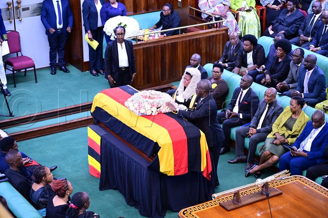 Speaker Anita Annet Among and her deputy Thomas Tayebwa, laying a wreath on the casket of Kalangala District Woman MP, Helen Nakimuli. (Credit: Miriam Namutebi)