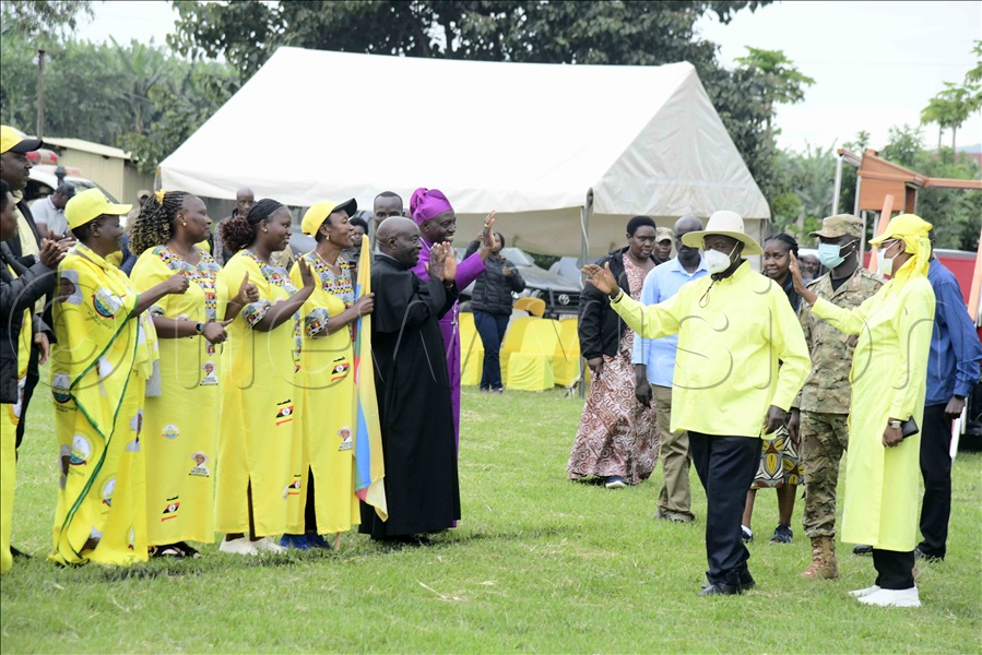 President Yoweri Museveni and the First Lady greet NRM officials as they arrived at Kyamate Primary School playground for the latter's rally.