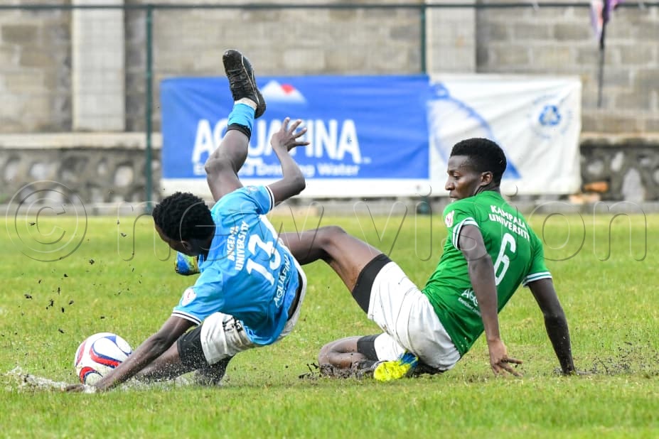 Kampala University&rsquo;s Kizito Adiilu puts in a timely tackle on Bugema University&rsquo;s Kenneth Bukenya during the UFL quarterfinal return leg at the FUFA Stadium, Kadiba on Monday. The hard-fought 0-0 draw saw KU advance to the semifinals on the away goals rule following a 1-1 aggregate stalemate. (Photo by Richard Sanya)