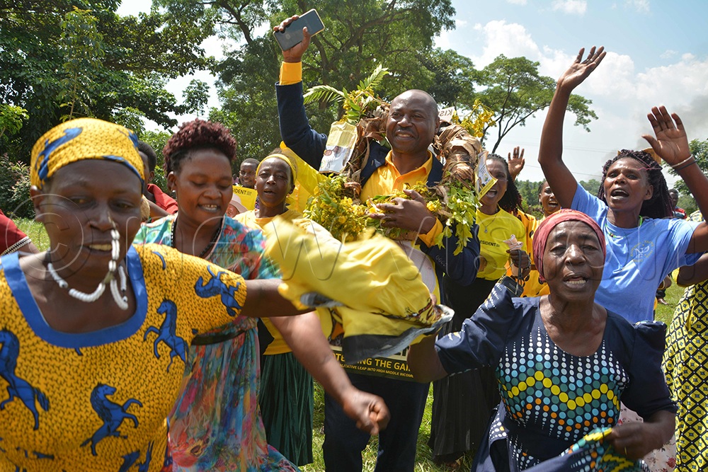 Women dance as they welcomed the NRM party flag bearer Paddy Kisembo to the campaigning venue in Kidoma village. (Credit: Peter Abaanabasazi)