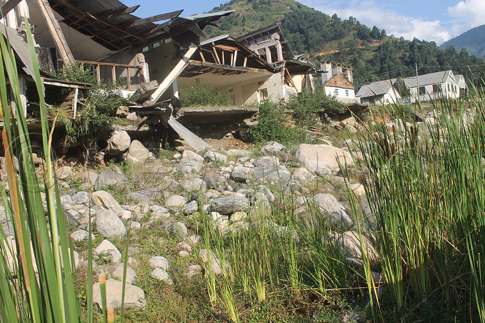 A photo of Kilembe Mines Limited headquarters which have since 2013 turned into rubbles with boulders brought about by River Nyamwamba floods. (Photo by Samuel Amanyire)