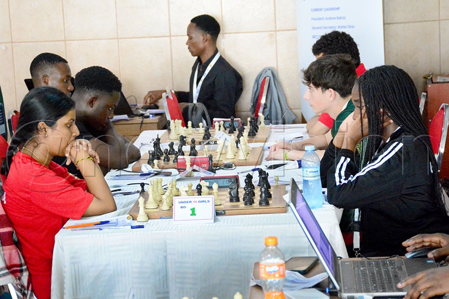 Uganda&rsquo;s Sana Omprakash (left) takes on Zuri Tatiina (right) in the girls U-18 category during the first round of the Africa Youth Chess Championship. Photo by Michael Nsubuga