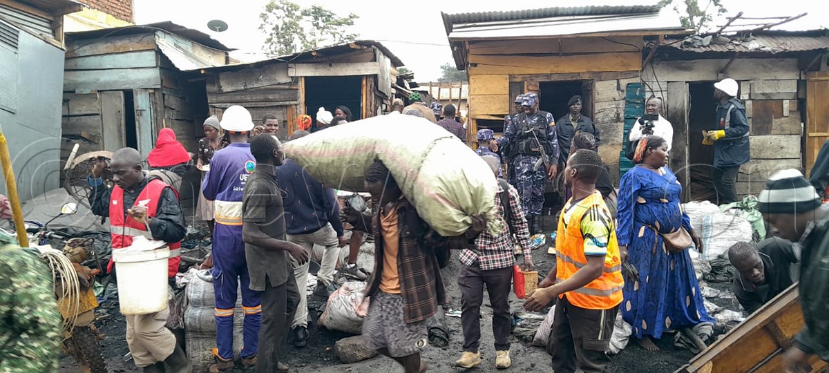 Traders in Mbale city empty shops of their merchandise under the watchful eye of police before the structures were demolished on Tuesday.