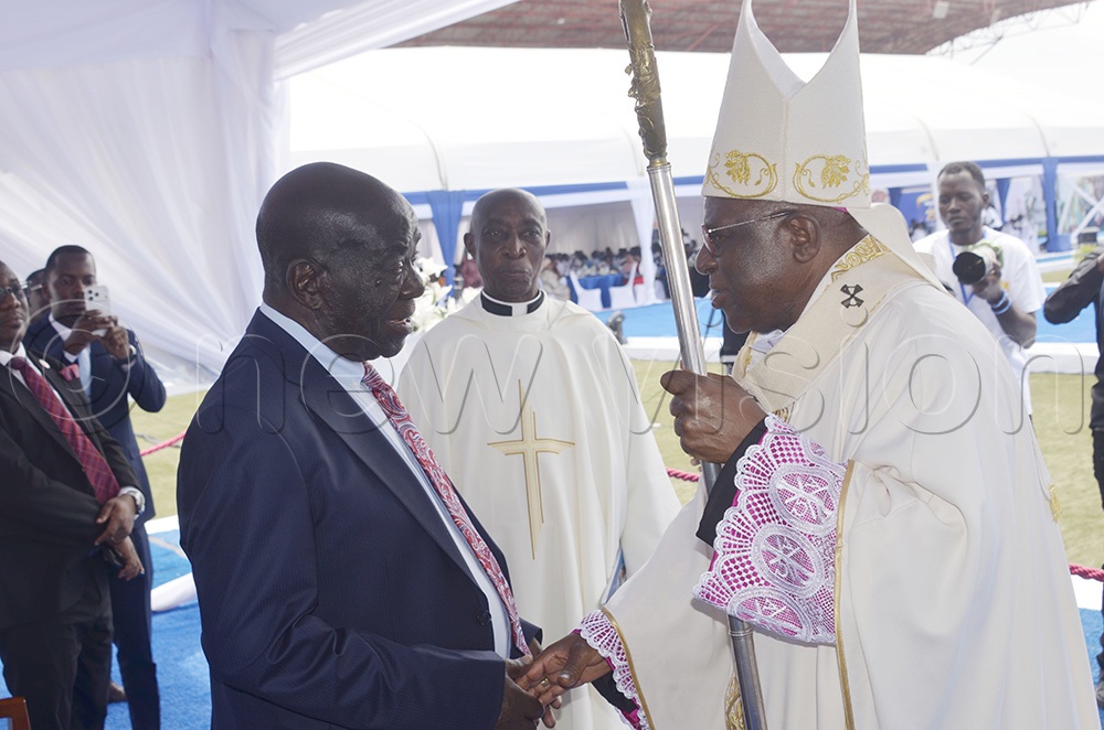The Archbishop of Kampala, Paul Ssemogerere, greets the former Vice-President, Hon. Edward Kiwanuka Ssekandi, before the Mass he led to kick off celebrations marking 25 years of academic and spiritual excellence of St Mary’s Secondary School Kitende (SMASK). (Photo by Juliet Anna Lukwago)