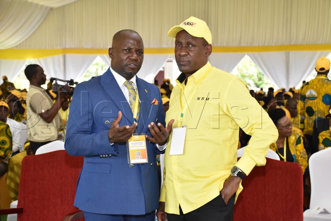 Kiwanda and Mike Mukula interacting at the delegates conference.