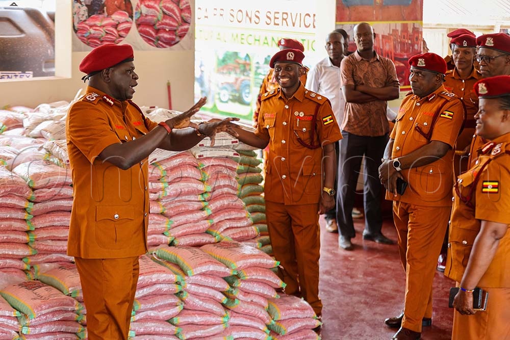 The Deputy Commissioner Generalof Prisons Samuel Akena explains a point to prisons officers during their tour of the Uganda Prisons Services stall at the 32nd National Agricultural show held in Jinja city recently. (Credit: Petride Mudoola)