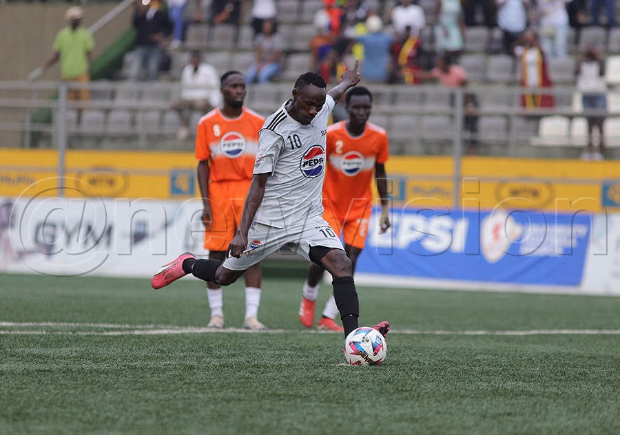 SLAU's Lawrence Mugerwa takes a penalty during their game against MUBS 