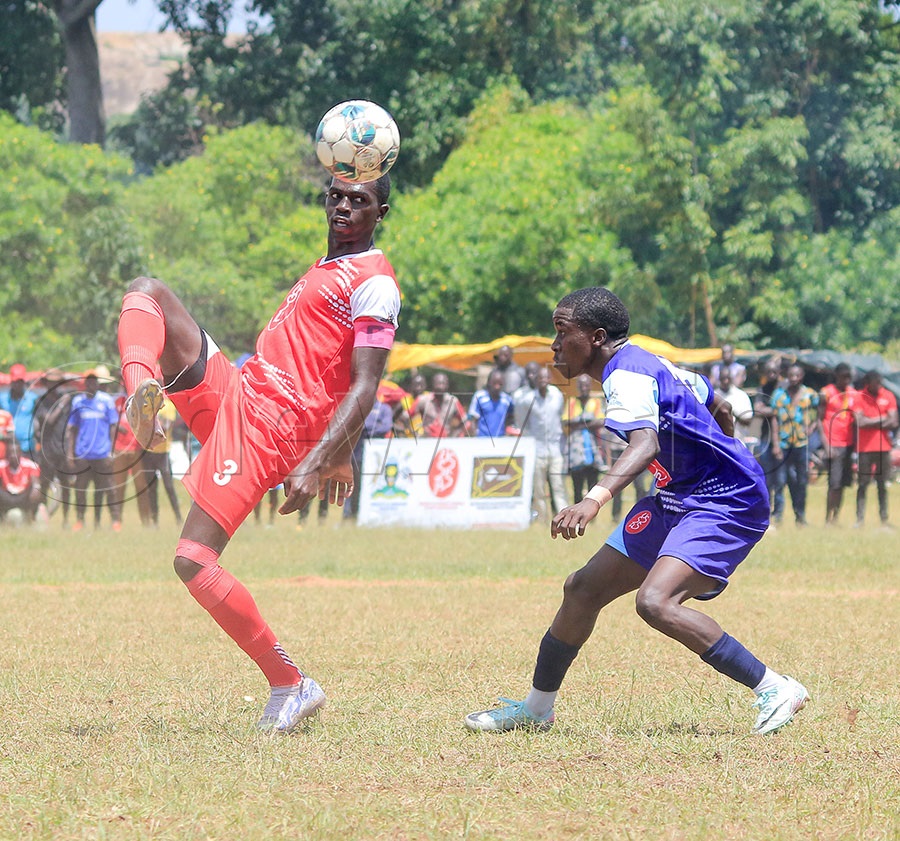 St Mary Kitend School, Simon Mukisa shows off his skills in their game against Kibuli SS. Photos by Gabriel Esiku