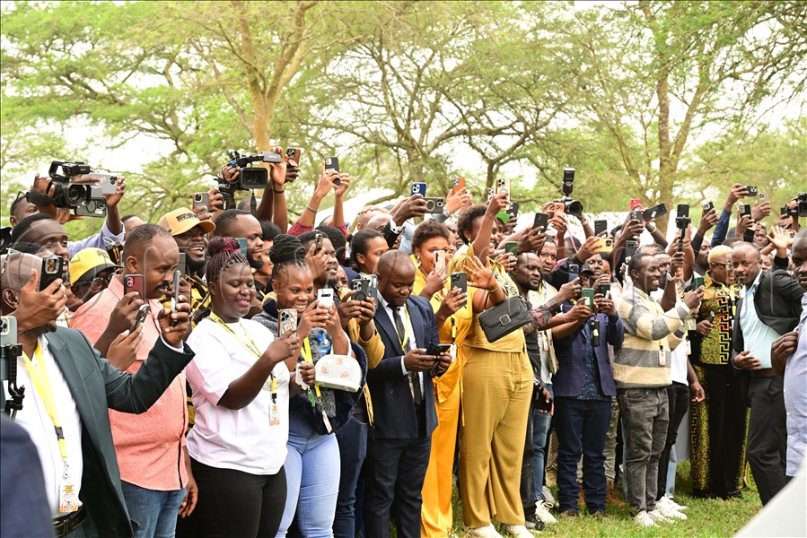 Happy content creators capture the President's arrival, prior to meeting them.