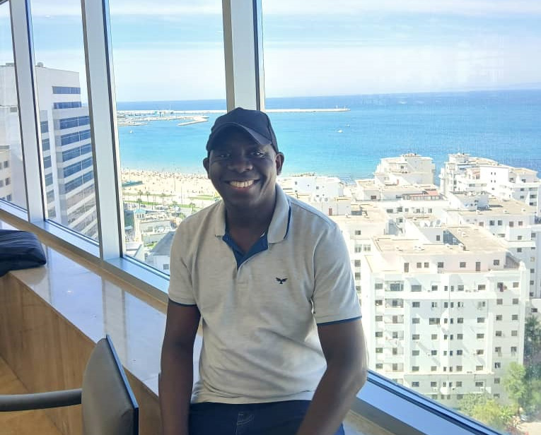 The writer, Fred Kaweesi, at Hilton Hotel that provides a good view to the Atlantic. Hilton will be one of the 2025 AFCON hotels.