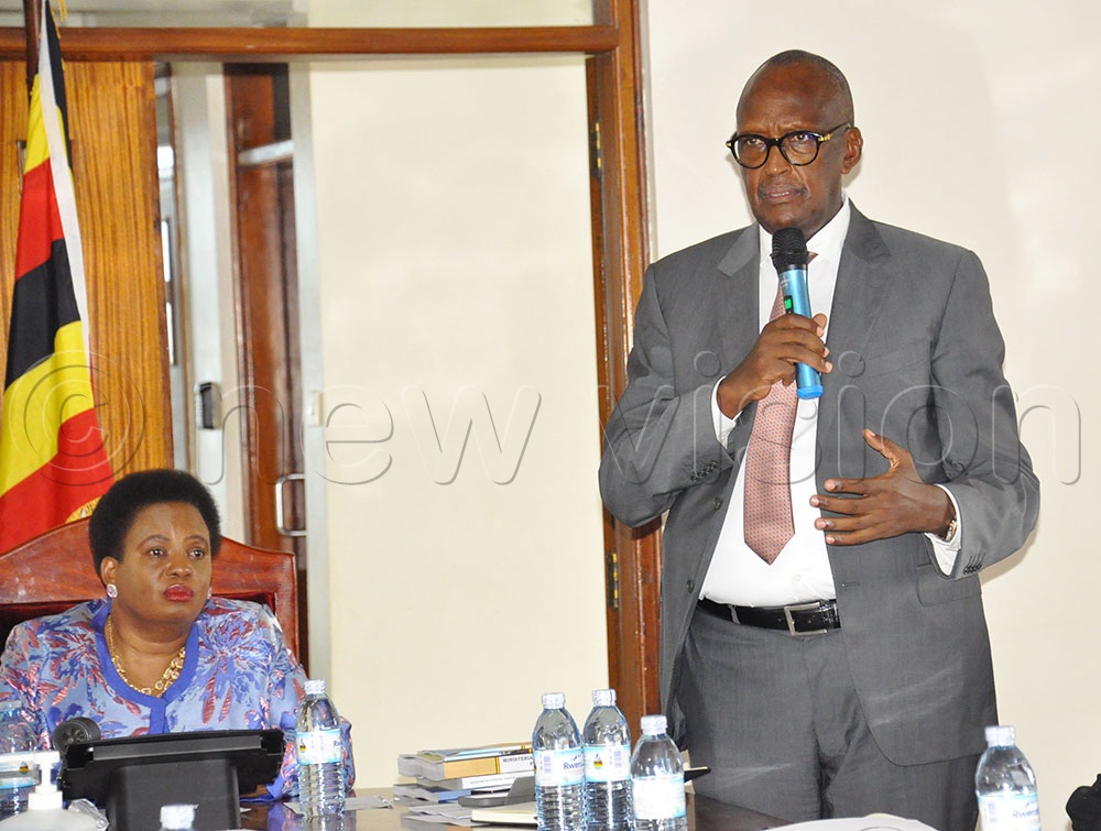 Betty Amongi Outgoing Minister of Gender looks on as Henry Tumukunde incoming Minister of Gender remarks during the handover ceremony at Ministry of Gender head offices in Kampala on June 10, 2026. (Credit: Nancy Nanyonga)