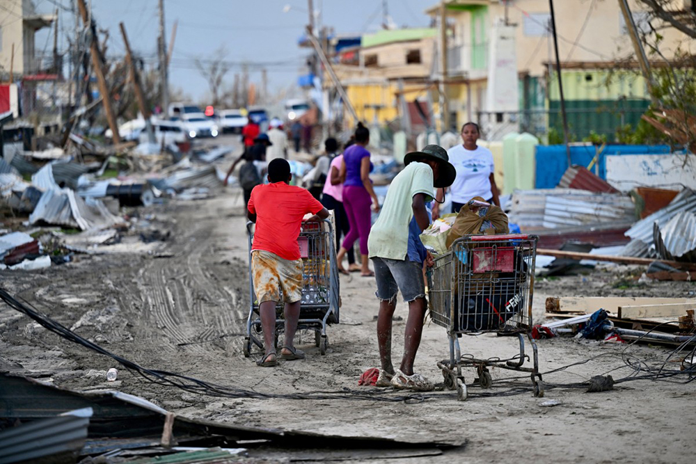 Black River residents are scavenging for food on the streets of Black River following the passage of Hurricane Melissa, in Santa Cruz, St Elizabeth, Jamaica on October 29, 2025. (AFP)
