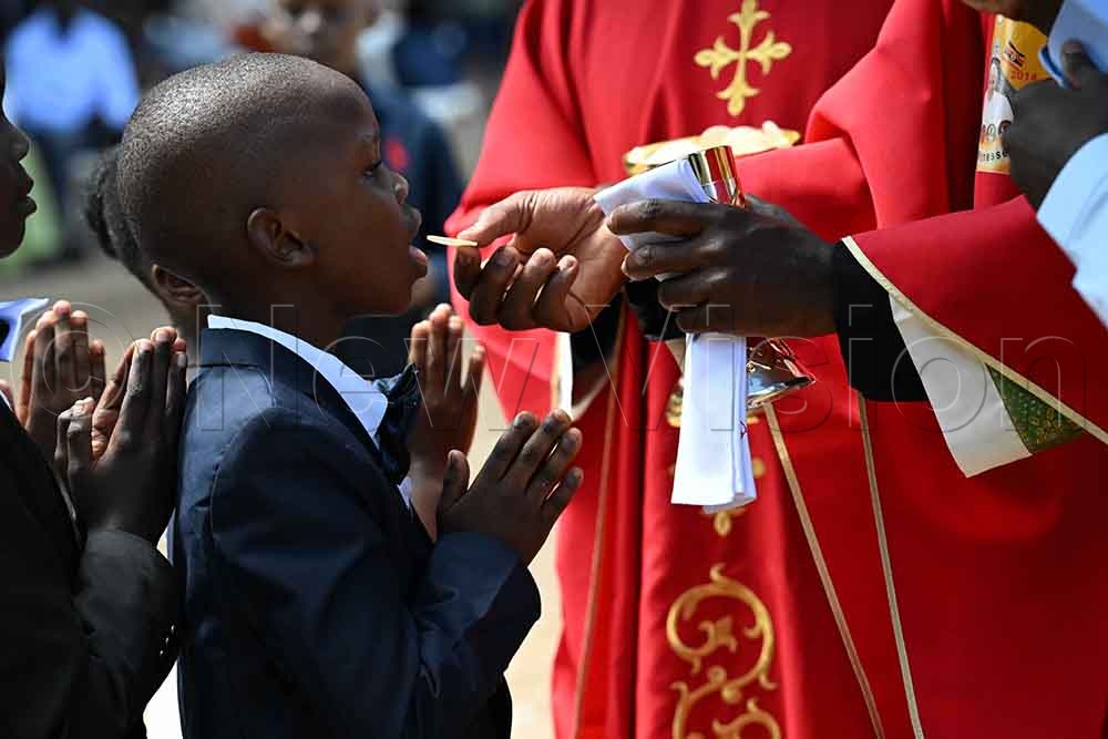 Confirmands receive Holy Communion. (All Photos by Maria Wamala)