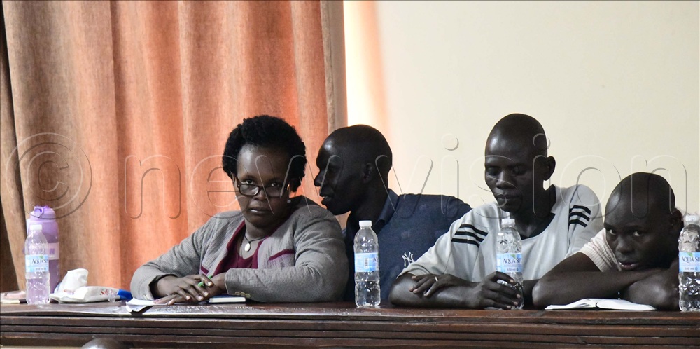 Susan Vivian Ariokot (left) sharing with her husband Josephn Okedi, seated next to him is Edoket and Obotol leaning on the dock