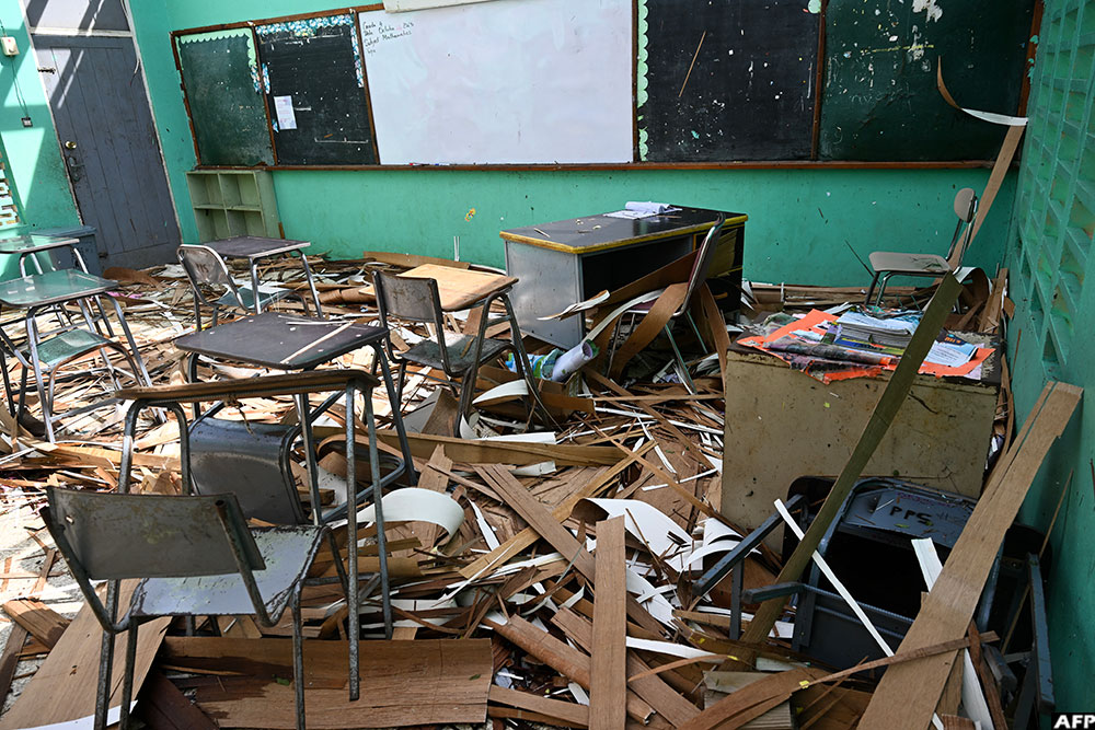 A classroom at Pondside Primary School is seen filled with debris and without a roof in Santa Cruz, St. Elizabeth, Jamaica