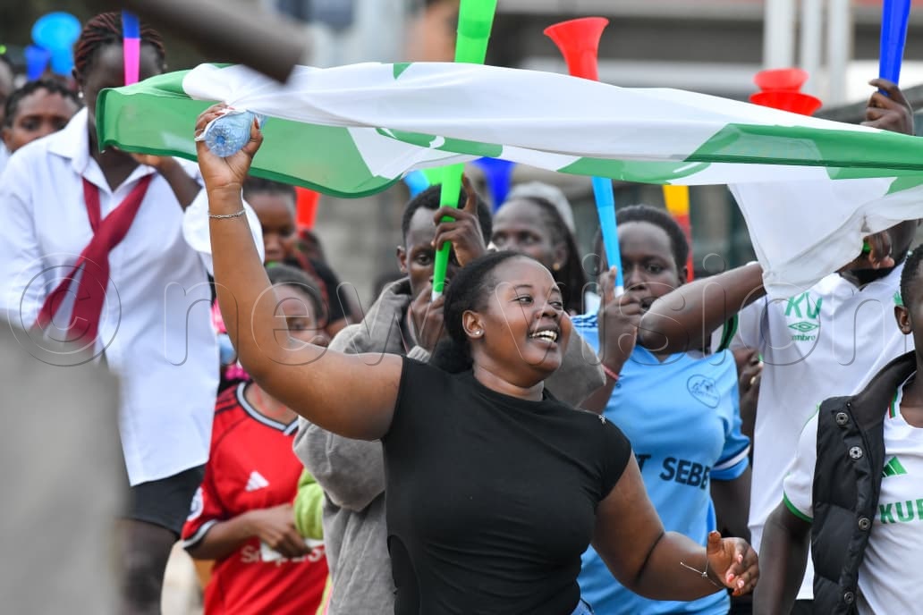 Kampala University fans erupt in celebration at the FUFA Stadium in Kadiba after their goalless draw against Bugema University on Monday. The result was enough to send the two-time champions through to the UFL semifinals, courtesy of the away goals rule following a 1-1 draw in the first leg. (Photo by Richard Sanya)