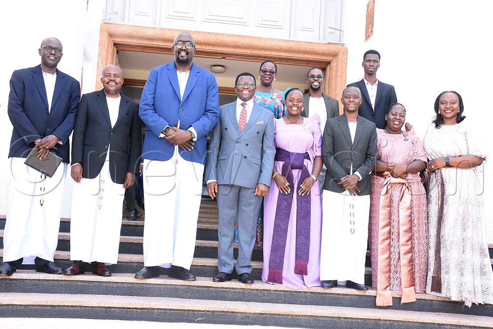 Buganda kingdom premier (Katikkiro) Charles Peter Mayiga poses for a photo with Uganda Media Centre executive director Allan Kasujja and his delegation. (Photo by Dickson Kulumba)