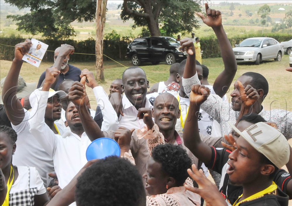 Seth Murari being congratulated by his supporters after winning at his polling station in Kafunjo, Kakiika.