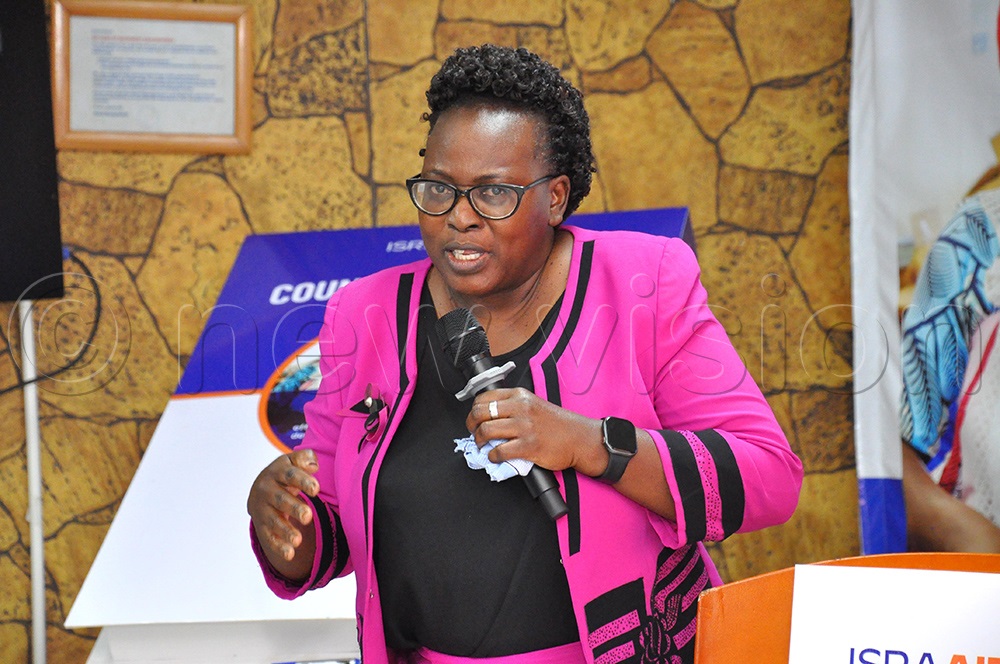 Mary Harriet Ajilong, the Commissioner Guidance and Counselling at the Ministry of Education, addressing participants during the launch of 2025–2028 Strategy to Strengthen Refugee Resilience. (Photo by Nancy Nanyonga)