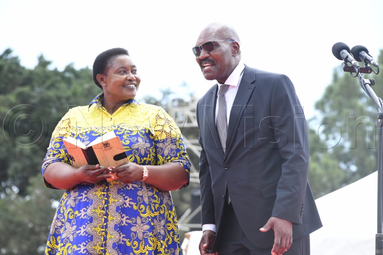 Minister for Presidency, Milly Babalanda, with Samson Mande. (Credit: Mpalanyi Ssentongo)