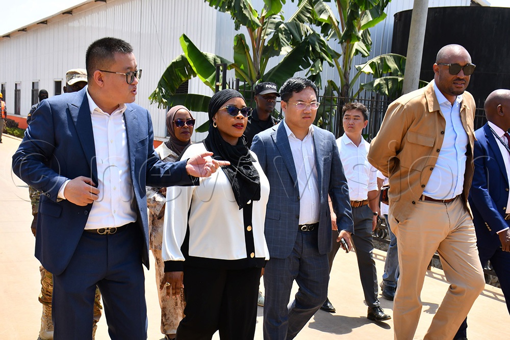 The State Minister for Privatisation and Investment, Hajjati Aminah Mukalazi (2nd left), listening to the deputy Managing Director of Tian Tang Group. (Photo by Donald Kiirya)