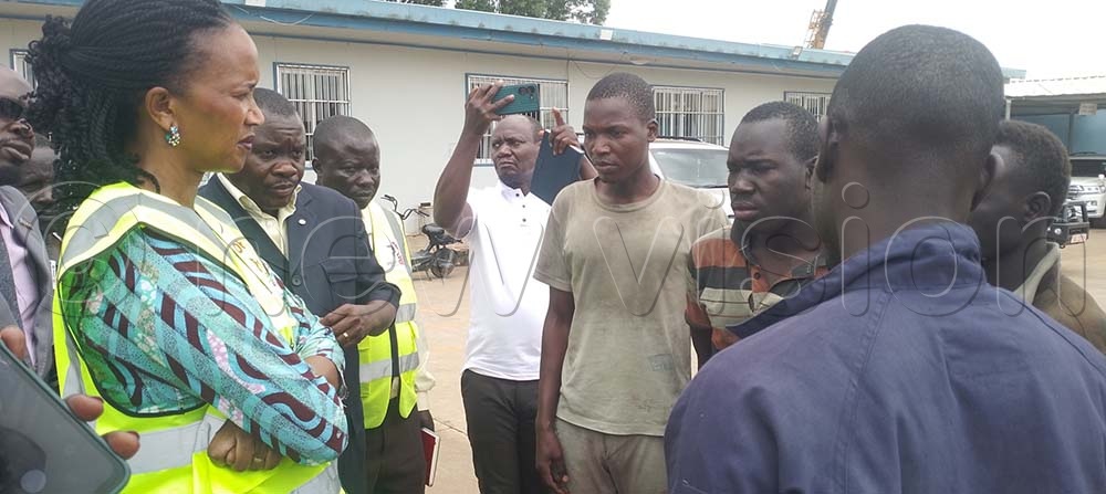 Minister Anyakun and her delegation talking to some of the factory workers. (Credit: Frederick Kiwanuka)