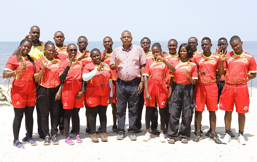 Uganda Woodball Federation President Paul Mark Kayongo (centre) poses with the national woodball team during their World Cup training camp in Bunjako on Sunday. PHOTO: Johnson Were
