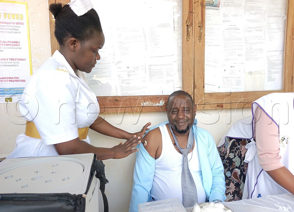 Paul Mubiwa, the Principal chief finance officer after recieving his shot at the launch of the yellow fever vaccination at the Jinja district headquarters. (Photo by Jackie Nambogga)