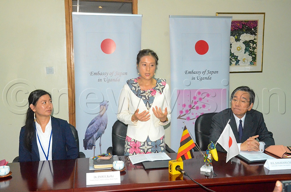 (L-R): The project coordinator of PWJ, Megumi Kubo, the country representative Dr Inoue Keiko (speaking) and the ambassador of Japan to Uganda, Takuya Sasayama at the grand signing (Photo by Isaac Nuwagaba)